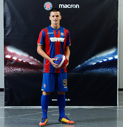 The Hajduk Split Away shirt 2017/18 has vertical red and blue bands with  gold details. The Macron logo stands out in white on the top right-hand  side of, By Macron