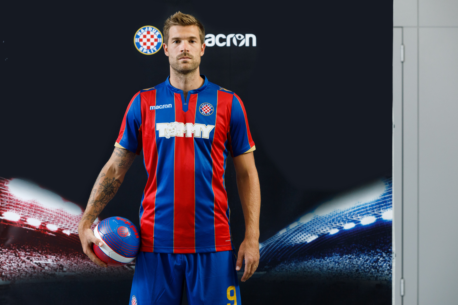 The Hajduk Split Away shirt 2017/18 has vertical red and blue bands with  gold details. The Macron logo stands out in white on the top right-hand  side of, By Macron